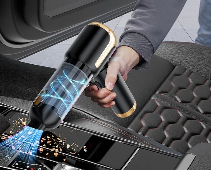 Lyiazsoy 4-in-1 car vacuum in black and gold cleaning crumbs from a car centre console